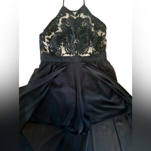 Francesca's Cate High Neck Maxi Romper This  features an embellished bodice.